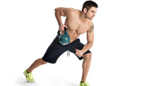 Man exercising with kettlebells