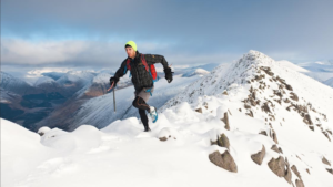 Andrew Murray running on a snowy mountain