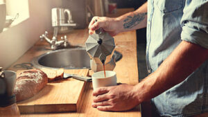 man pouring coffee